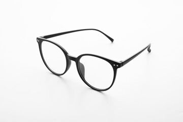 Stylish eyeglasses on white background