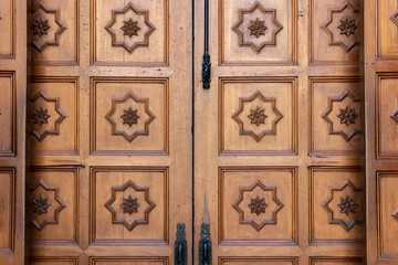 Carved wooden doors at the entrance of a church