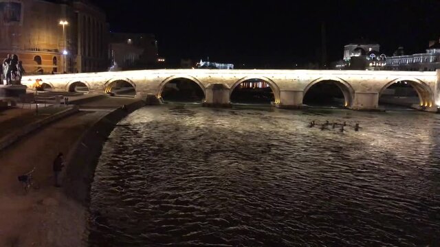 Stone Bridge at night in Skopje, Macedonia. Stone bridge is considered a symbol of Skopje.
