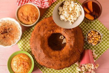 Traditional food for Festa Junina (June Festival) on color wooden background