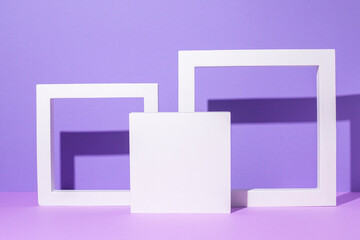 Square white and frame podiums for pedestal presentations on a purple background