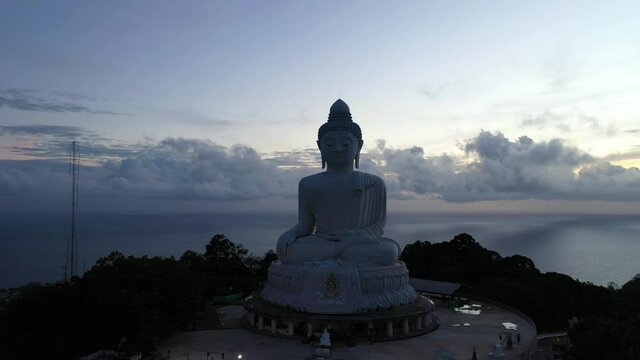 .aerial view white big Phuket Buddha in dark blue sky at twilight..Phuket Big Buddha another tourist attraction of Phuket .that has been quiet during the Covid-19 epidemic.