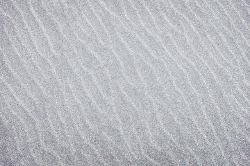 Fototapeta na wymiar Sand texture with wave pattern