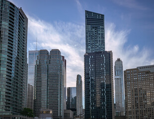 Cluster of new skyscrapers in Downtown Toronto on a blue and cloudy sky background