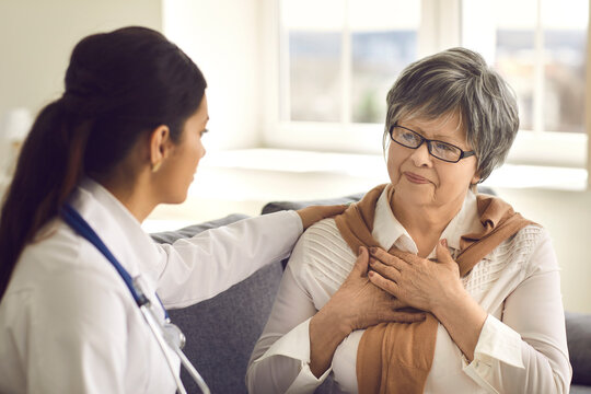 Ederly patient came to her doctor for a medical examination and told about her health. Concept of medical care for the elderly and the interaction of the doctor with the patient.