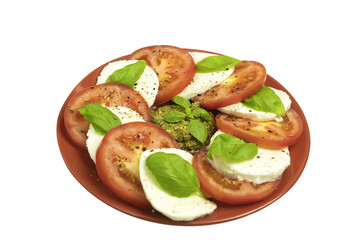 Caprese salad in a plate on a white isolated background