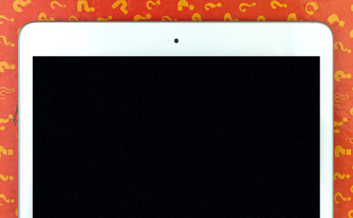 Learining and lessons background with digital tablet mockup screen with space for your text, question signs on the background