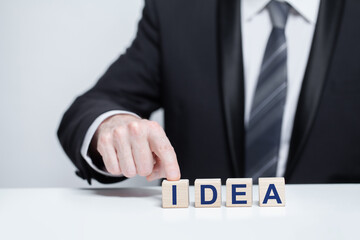Obraz premium Businessman and idea inscription. Business idea concept
