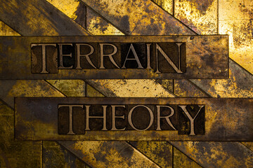 Terrain Theory text on vintage textured grunge copper and gold background