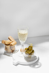 white wine in a glass on a white background
