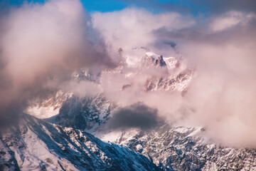 Sunset Clouds in the Snowy Mountains