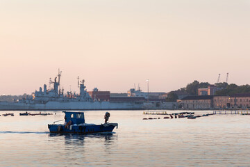 Sea port. Ships and boats at dawn. Sea town.