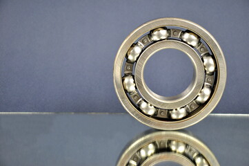 Ball bearing on a mirror surface. Spare parts.