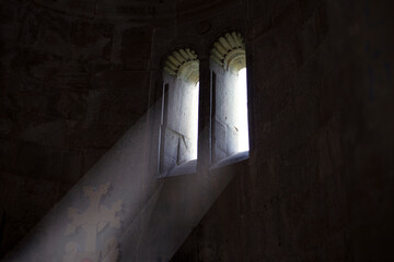 light falling through a window in an old church