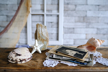 stack of vintage photos, old photography of 1940-1950 on wooden table, concept of genealogy, the...