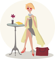 Obraz premium Beautiful young lady in a cafe drinking coffee