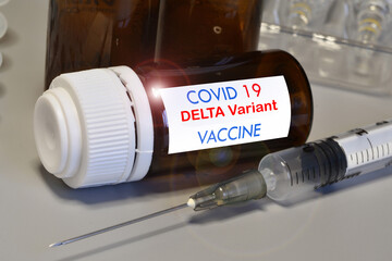 Covid-19 Delta variant strain vaccine. Syringe and vaccine. Treatment for coronavirus covid-19.