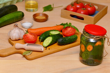 vegetables for preservation and a tin of pickled cucumbers