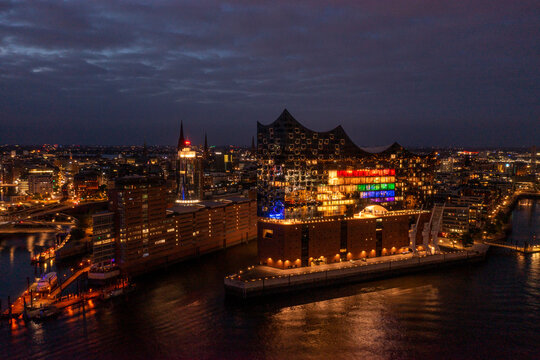 Hamburg, Germany, Panorama of the Harbour at night. With the colored illuminated music hall at Christopher Street Day