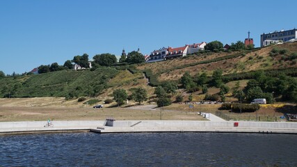 Fototapeta na wymiar a panorama of Plock (Poland) from the side of the Vistula River 