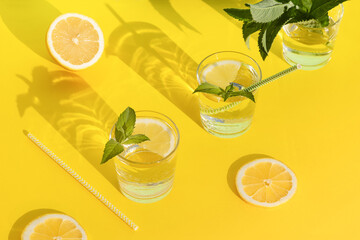 summer drink. cool refreshing beverage with mint and lemon in glass with paper tube. zero waste...