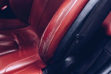 Damaged leather car seat. Modern car interior