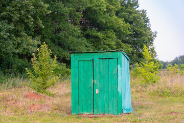 Wooden toilet in the forest.