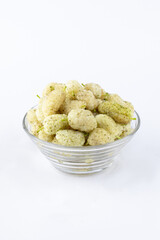 White mulberry with leaf closeup isolated on light background
