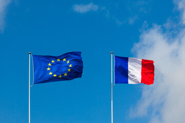 EU flag and France flag are on blue sky. Concept relations between Europe and France - 441848943