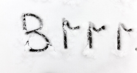drawn on the snow, temperature symbols denoting negative very cold weather
