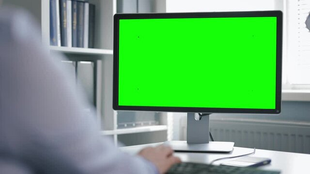 Office computer with green monitor