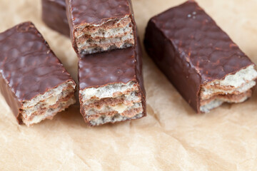 close-up of chocolate candies and crispy flour waffles