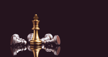 Stand of golden king chess and fallen silver king chess. Winner of business competition and...