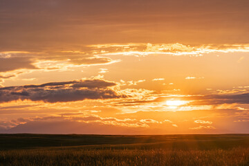 Sunset With Clouds on Great Plains of Wyoming with Mountains