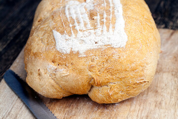 fresh loaf of wheat flour bread