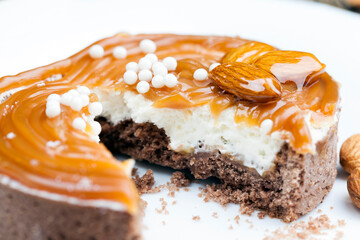 tartlet with milk cheese filling and lots of salted caramel with nuts