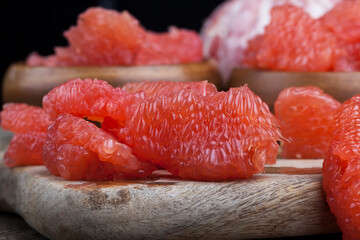 peeled red grapefruit divided into slices