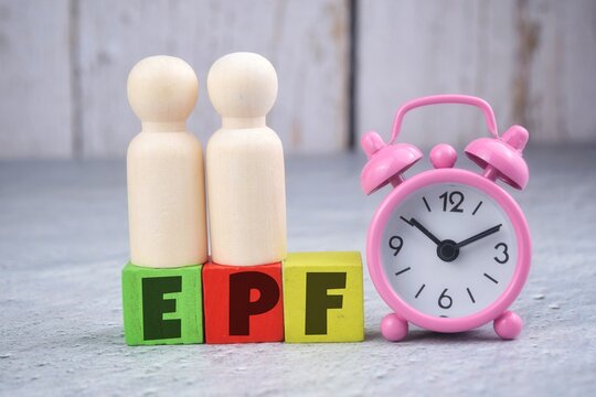 Human Wooden Doll With EPF Or Employee Provident Fund Wording. Finance Concept