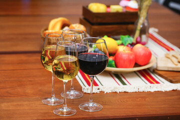 variety fruit with white and red wine on reception desk