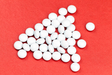 medicines for the treatment of diseases scattered on a red background