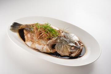 hong kong style steamed whole fresh grouper fish in soya salted sauce and ginger and garlic onion seafood asian menu