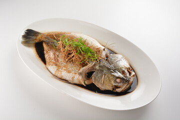 hong kong style steamed whole fresh grouper fish in soya salted sauce and ginger and garlic onion seafood asian menu