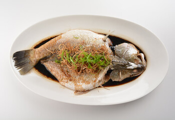 hong kong style steamed whole fresh grouper fish in soya salted sauce and ginger and garlic onion seafood asian menu