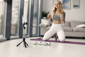 Fototapeta premium Girl in a sports uniform make yoga at home