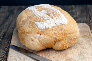 fresh loaf of wheat flour bread