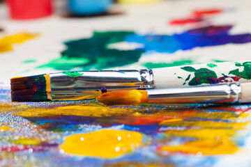 Fototapeta premium mixed together multi-colored paints for creativity and drawing