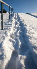 footprints on snowdrifts after walking
