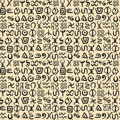 Seamless pattern. Abstract symbols of African tribes. Vector doodles of ancient ethnic traditional symbols.