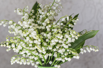 Bouquet of may lilies of the valley on a white background. High quality photo
