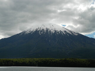 Fototapeta premium Volcano Osorno covered with clouds